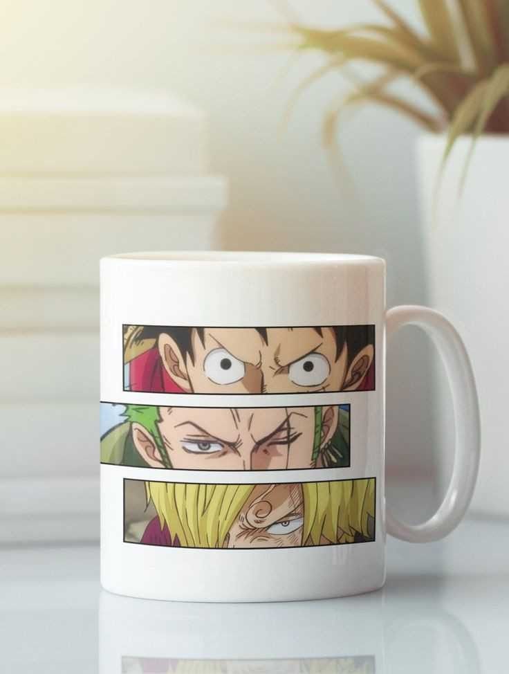 A white ceramic mug featuring three horizontal panels of anime character artwork, shown on a reflective white surface with a softly blurred indoor background.