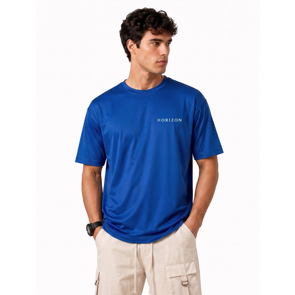 A man wearing a royal blue short-sleeve t-shirt with 'HORIZON' printed in white on the chest, paired with beige cargo pants, against a plain white background.